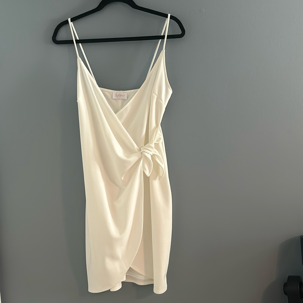 Women’s white dress with wrap front